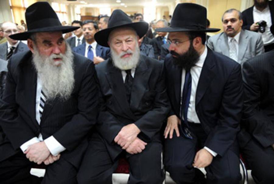 Rabbi Yehuda Krinsky, center, late last year.(Indranil Mukherjee/AFP/Getty Images)