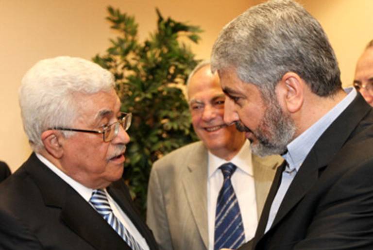P.A. President Abbas (L) and Hamas leader Khaled Meshaal (R) in Cairo today.(PPM via Getty Images)
