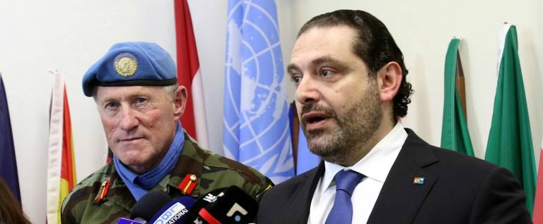Lebanese Prime Minister Saad Hariri (R) talks to the press next to the Head of Mission and Force Commander of the United Nations Interim Force in Lebanon (UNIFIL), Major General Michael Beary of Ireland, during a visit to the UNIFIL headquarters in the southern Lebanon, April 21, 2017.
