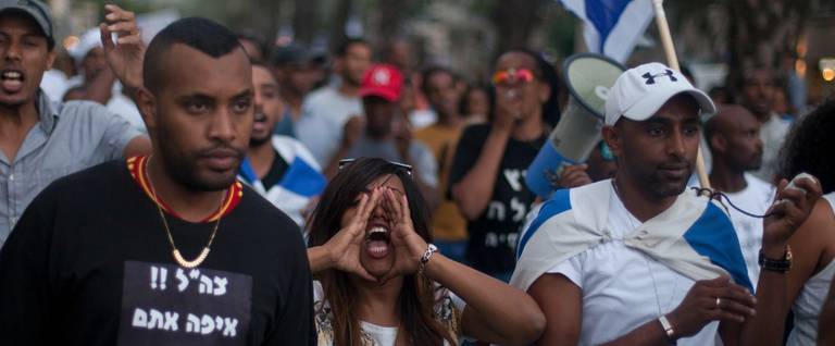 Israelis of Ethiopian origin and their supporters protest against racism and excessive aggression by Israeli police on June 22, 2015 in Tel Aviv, Israel. 