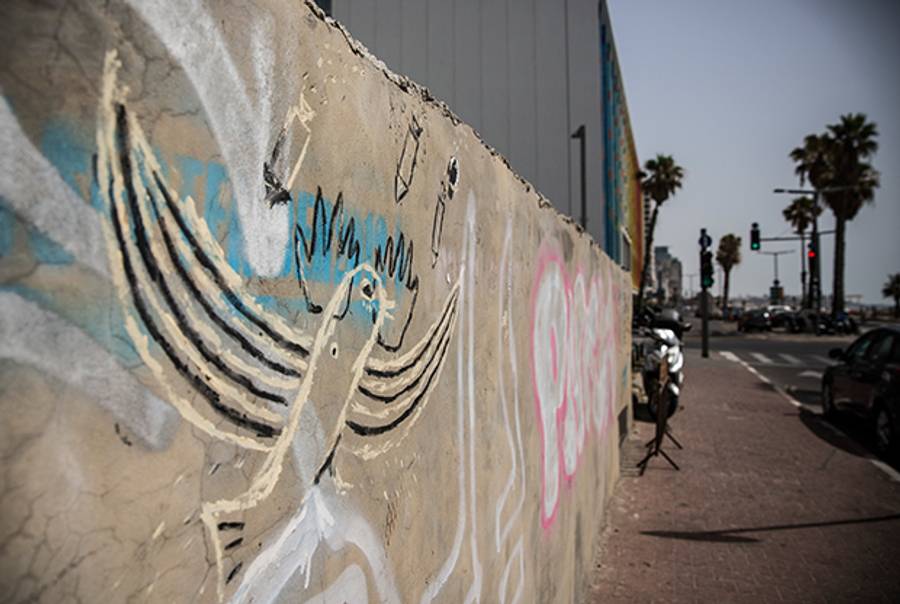 Graffiti of a flying bird being attacked by rockets is seen on a wall in Tel Aviv, Israel on July 12, 2014. (Andrew Burton/Getty Images)