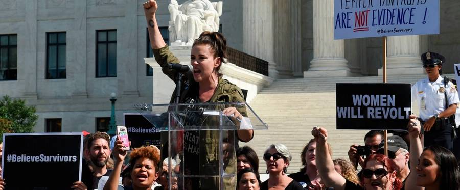 Actor Alyssa Milano speaks to demonstrators protesting against Judge Brett Kavanaugh's nomination as an associate justice on the Supreme Court in front of the Supreme Court in Washington, D.C., Sept. 28, 2018.
