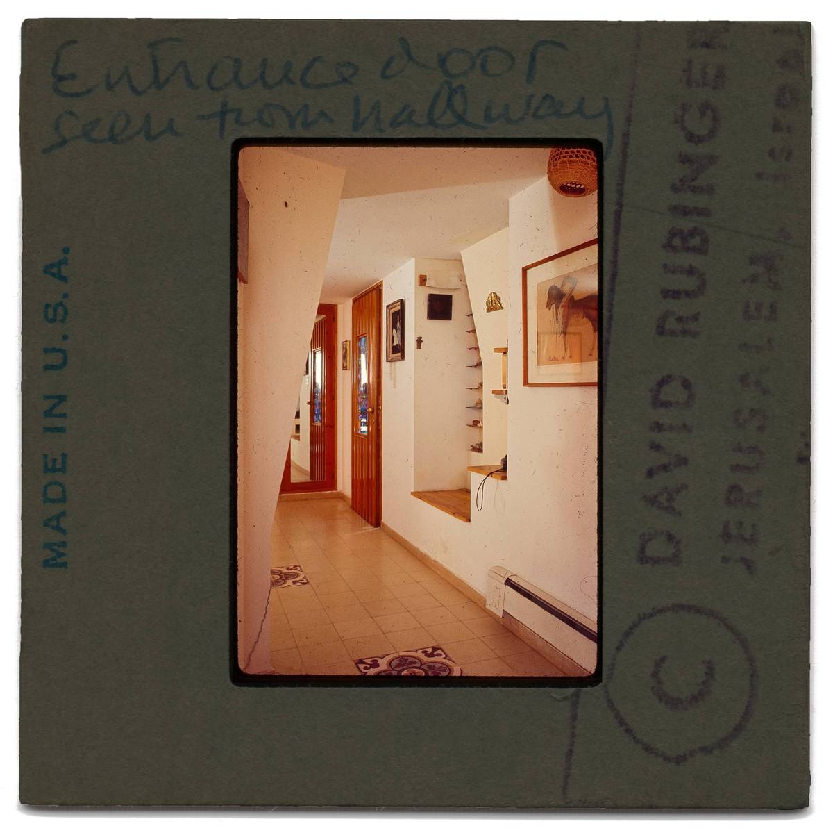 The entrance hall. Note the squares of decorative tile on the floor. When my father was building his house there were whole neighborhoods of old Palestinian homes being torn down in nearby Jaffa. My father would go around salvaging tiles that he then set in patterns throughout the home.