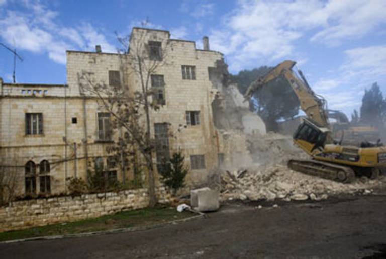 The Shepherd Hotel is destroyed on Sunday.(Ahmad Gharabli/AFP/Getty Images)