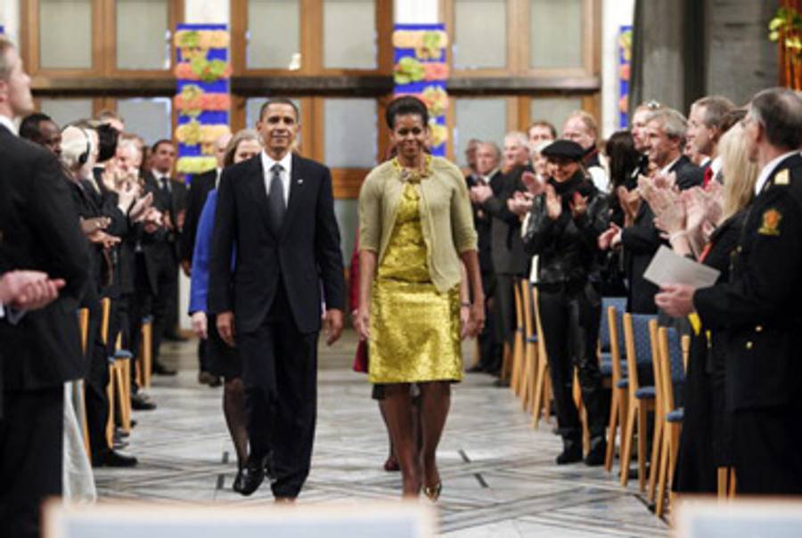 The President and First Lady arrive at the Nobel Ceremony this morning.(STR/AFP/Getty Images)