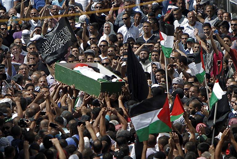Thousands of mourners gather for the funeral of Mohammed Abu Khdeir, 16, in East Jerusalem on July 4, 2014.(AHMAD GHARABLI/AFP/Getty Images)