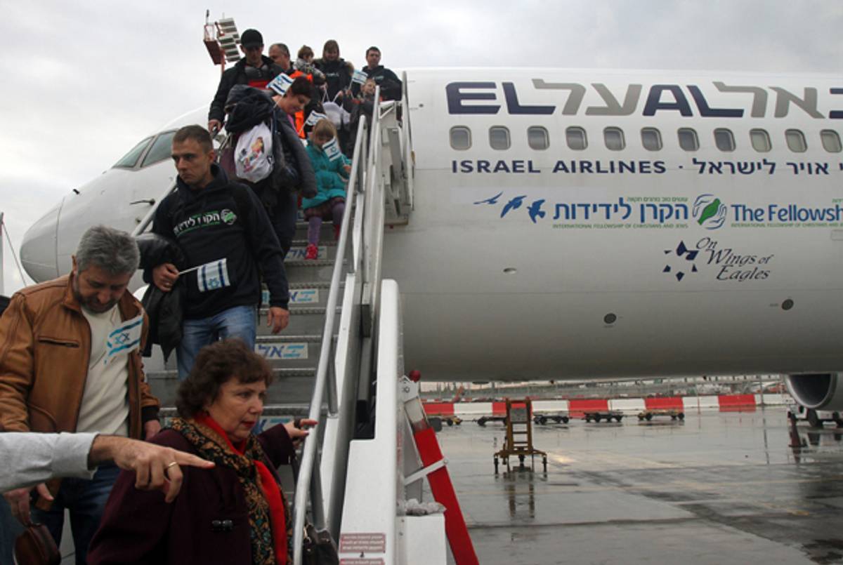 Jewish immigrants from Ukraine land at Israel'Ben Gurion International airport on December 22, 2014. (GIL COHEN-MAGEN/AFP/Getty Images)