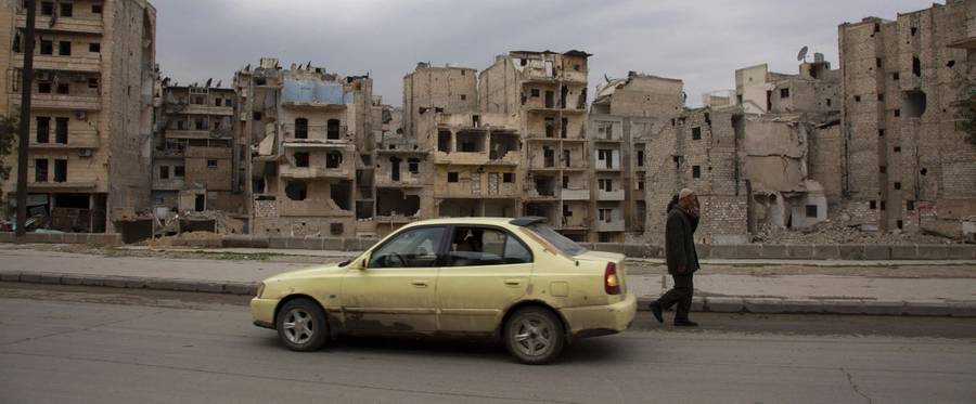 Ayoub, a 27-year-old Syrian man, drives his taxi on a street in the rebel-controlled side of Aleppo on March 3, 2016. Driving fearlessly under skies free of warplanes and bombs, taxi drivers in Syria's divided second city Aleppo are counting on a fragile truce to revive their trade.