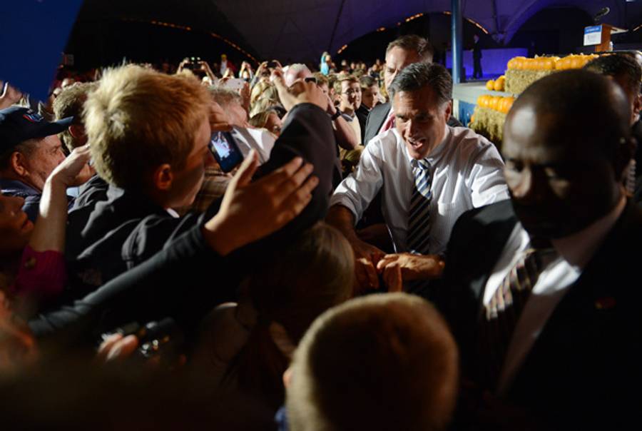 Mitt Romney greets supporters during a campaign rally in Jacksonville, Fla., Oct. 31, 2012.(Emmanuel Dunand/AFP/Getty Images)