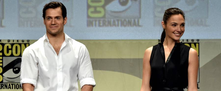Actors Henry Cavill (L) and Gal Gadot attend the Warner Bros. Pictures panel and presentation during Comic-Con in San Diego, California on July 26, 2014. (Photo by Kevin Winter/Getty Images)