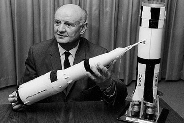 Arthur Rudolph, in NASA’s employ, showing off a Saturn V model.(Wikipedia)