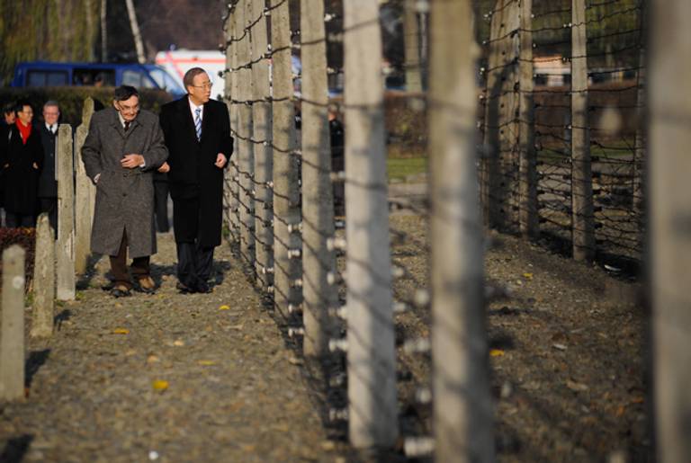 Secretary-General of the United Nations Ban Ki-moon (R) walks with former prisoner of Auschwitz Marian Turski, during a visit to the former Auschwitz concentration camp on November 18, 2013 in Oswiecim, Poland. (BARTOSZ SIEDLIK/AFP/Getty Images)