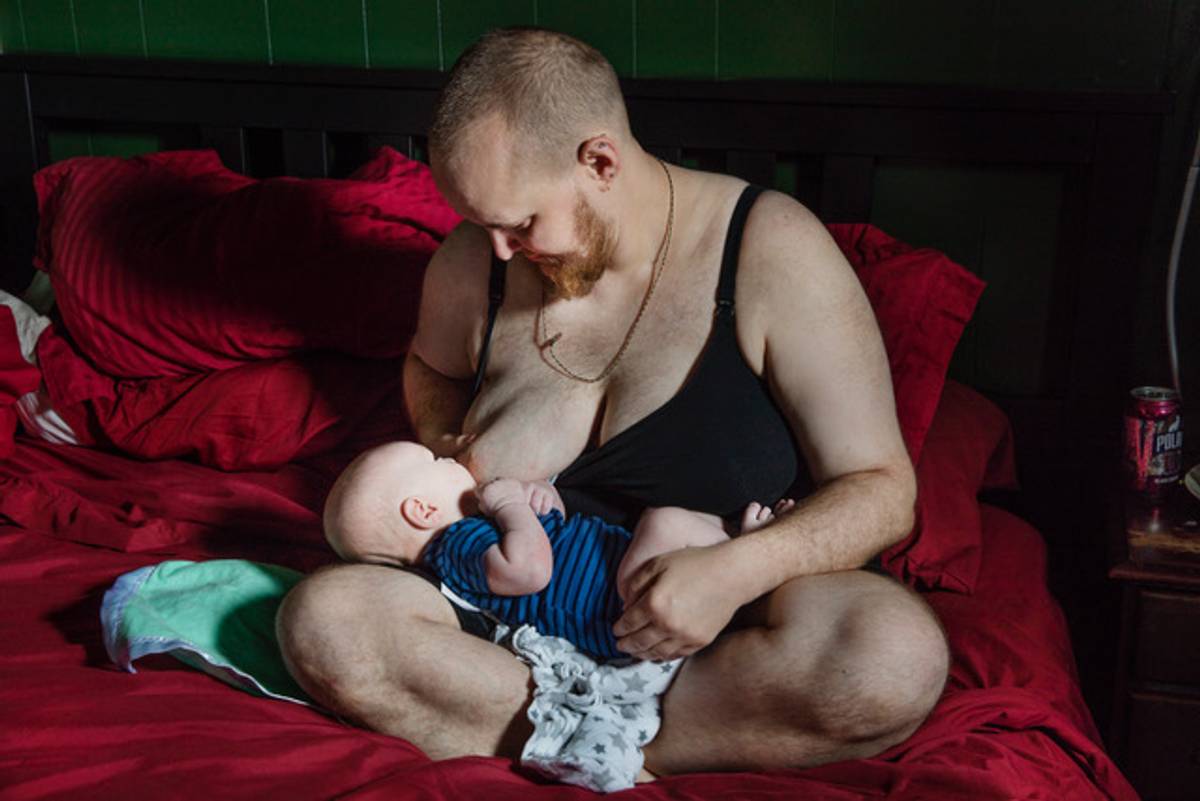 “Evan breastfeeding his son,” as it appeared in The New York Times. (Image courtesy of Elinor Carucci)