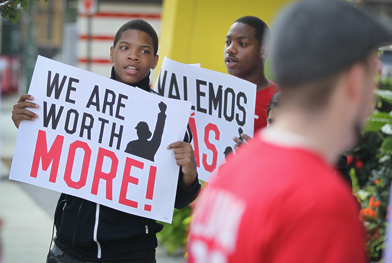 Fast-food workers and activists demonstrate outside McDonald's downtown flagship restaurant in Chicago on July 31, 2014. (Scott Olson/Getty Images)