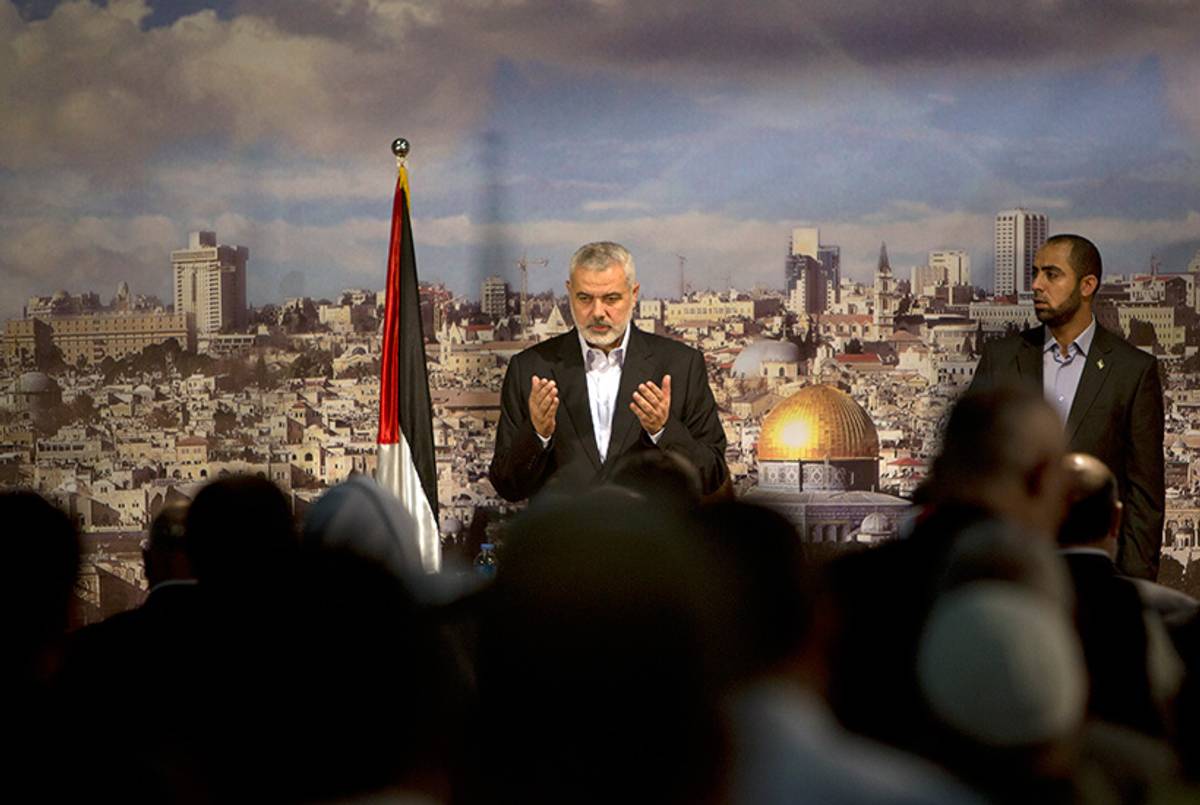 Hamas Prime Minister in the Gaza Strip Ismail Haniya prays prior to giving a policy statement in a televised address in Gaza City on Oct. 19, 2013. (Mahmud Hams/AFP/Getty Images)