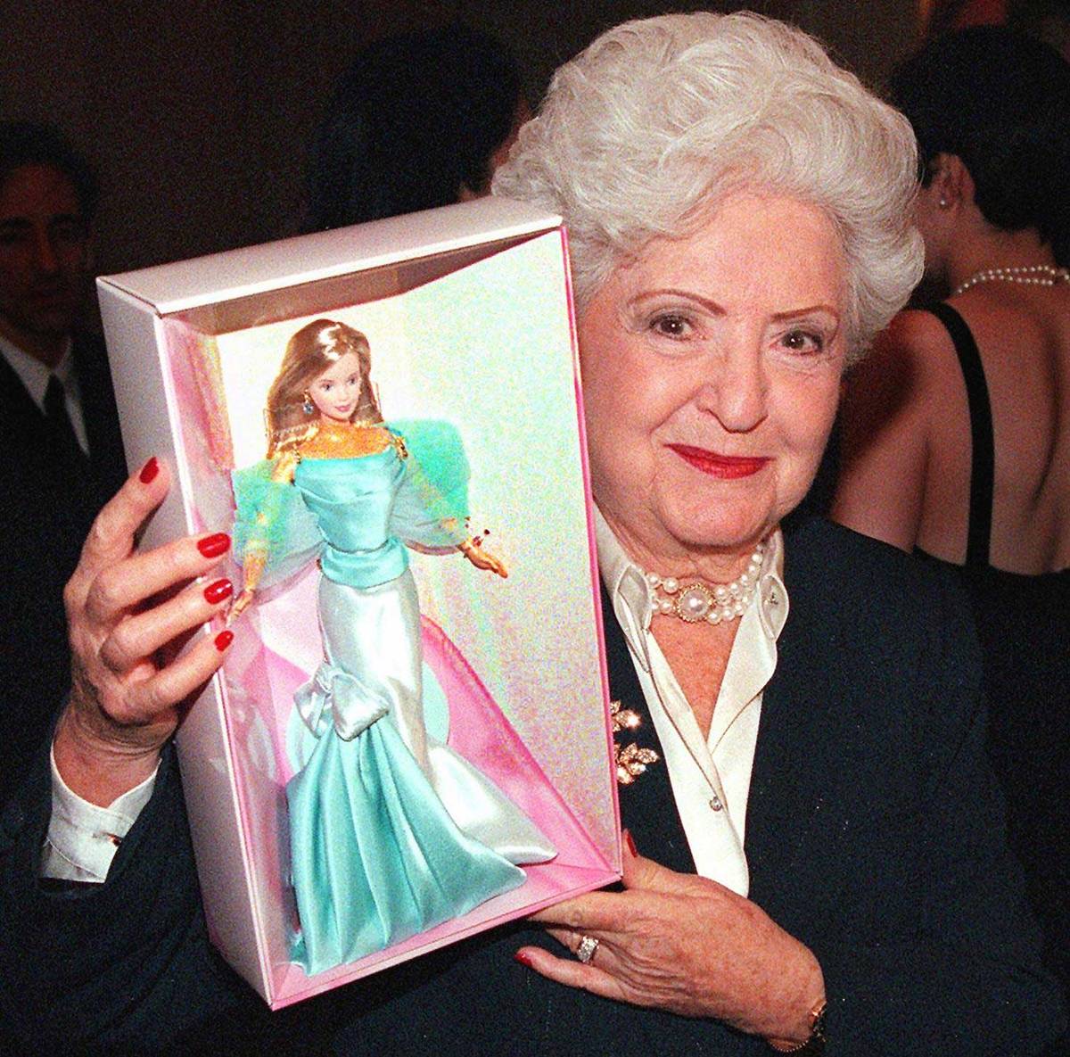 Ruth Handler holds a 40th Anniversary Barbie, in 1999