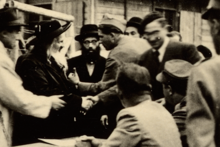 George Mandel-Mantello greets the Satmar Rebbe, Joel Teitelbaum, when he arrives in Switzerland on the Kasztner transport from Bergen-Belsen.(United States Holocaust Memorial Museum, courtesy of Enrico Mandel-Mantello)