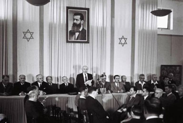 David Ben Gurion reads the Israeli Declaration of Independence in Tel Aviv on May 14, 1948.(Zoltan Kluger/GPO via Getty Images)