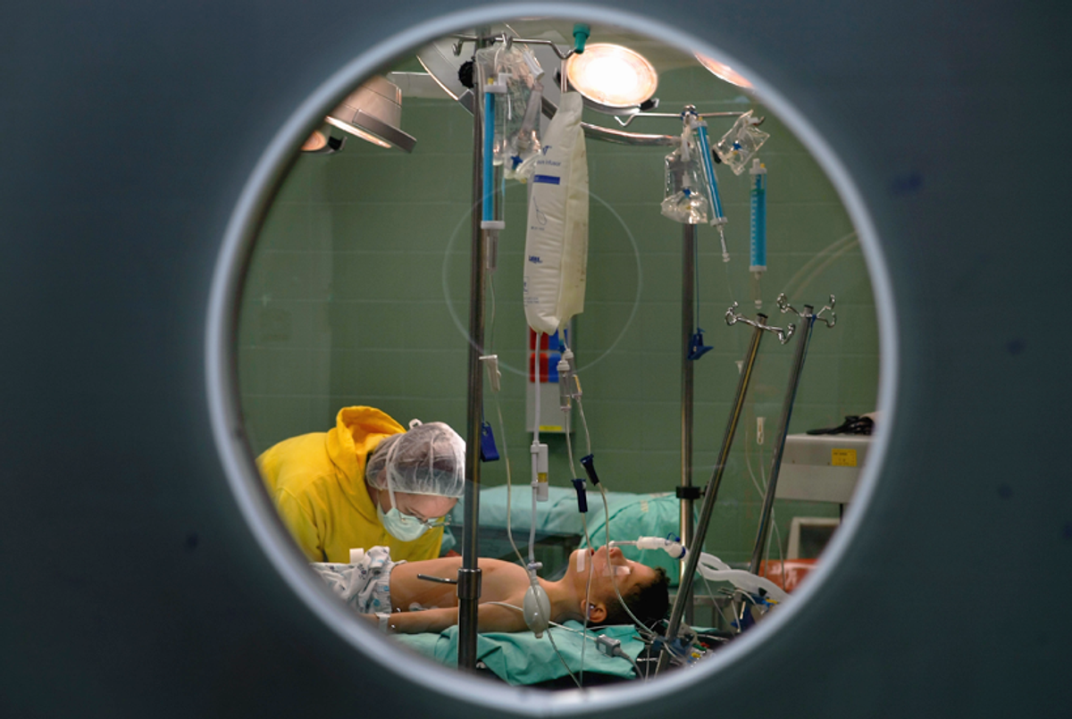 An Israeli nurse prepares Abdullah Siam for surgery to repair a congenital heart defect at the Wolfson Medical Center January 29, 2009 in Tel Aviv. The 6-year-old Palestinian boy's relative, Hamas Interior Minister Said Siam, was assassinated by Israel during an offensive in the Gaza Strip.(David Silverman/Getty Images)