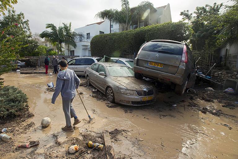 Damaged cars piled up due to heavy rains and flooding overnight in Beit Hefer, north of Tel Aviv, on Jan. 9, 2013. Israel and the Palestinian territories have been lashed by heavy rain and high winds since Jan. 6.(Jack Guez/AFP/Getty Images)