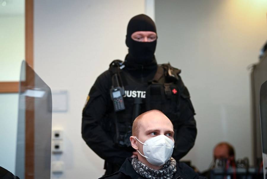Stephan Balliet, who was sentenced to life imprisonment for shooting dead two people after an attempt to storm a synagogue in Halle an der Saale, eastern Germany, is seen here waiting for the start of the 26th day of the trial at the district court in Magdeburg on Dec. 21, 2020