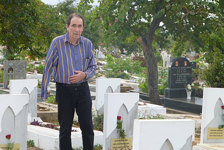 Albie Sachs stands next to the grave of anti-apartheid activist Ruth First at Llanguene Cemetery near Maputo, Mozambique. (Courtesy Abby Ginzberg)