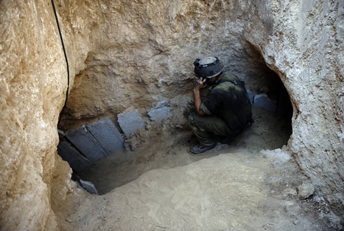 An Israeli soldier is seen at the entrance of a tunnel dug by Palestinians beneath the border between the Gaza Strip and Israel on October 13, 2013. ( DAVID BUIMOVITCH/AFP/Getty Images)