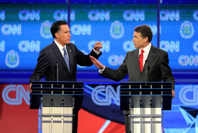 Mitt Romney and Rick Perry at the Republican presidential debate October 18, 2011. (Photo by Ethan Miller/Getty Images)