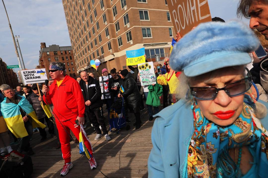 Dmitrii Sorokin, at left, gives a speech as people gather for a rally in support of Ukraine on the Brighton Beach Boardwalk in Brooklyn on March 6, 2022. Hundreds of people assembled in this Russian American neighborhood to show support for Ukraine as the Russian invasion continues.
