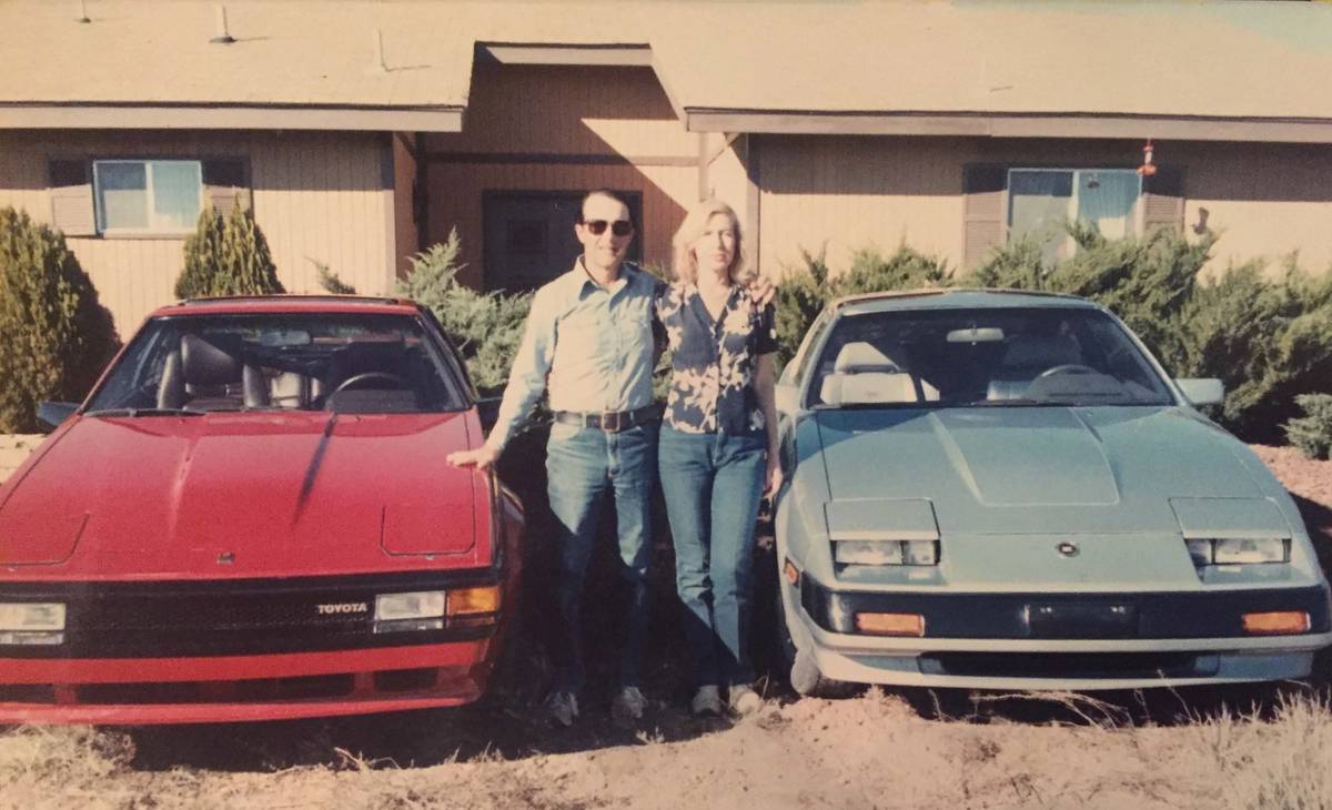 Jerry and Rita, circa 1985, with his red Toyota Supra and her blue Nissan 280ZX