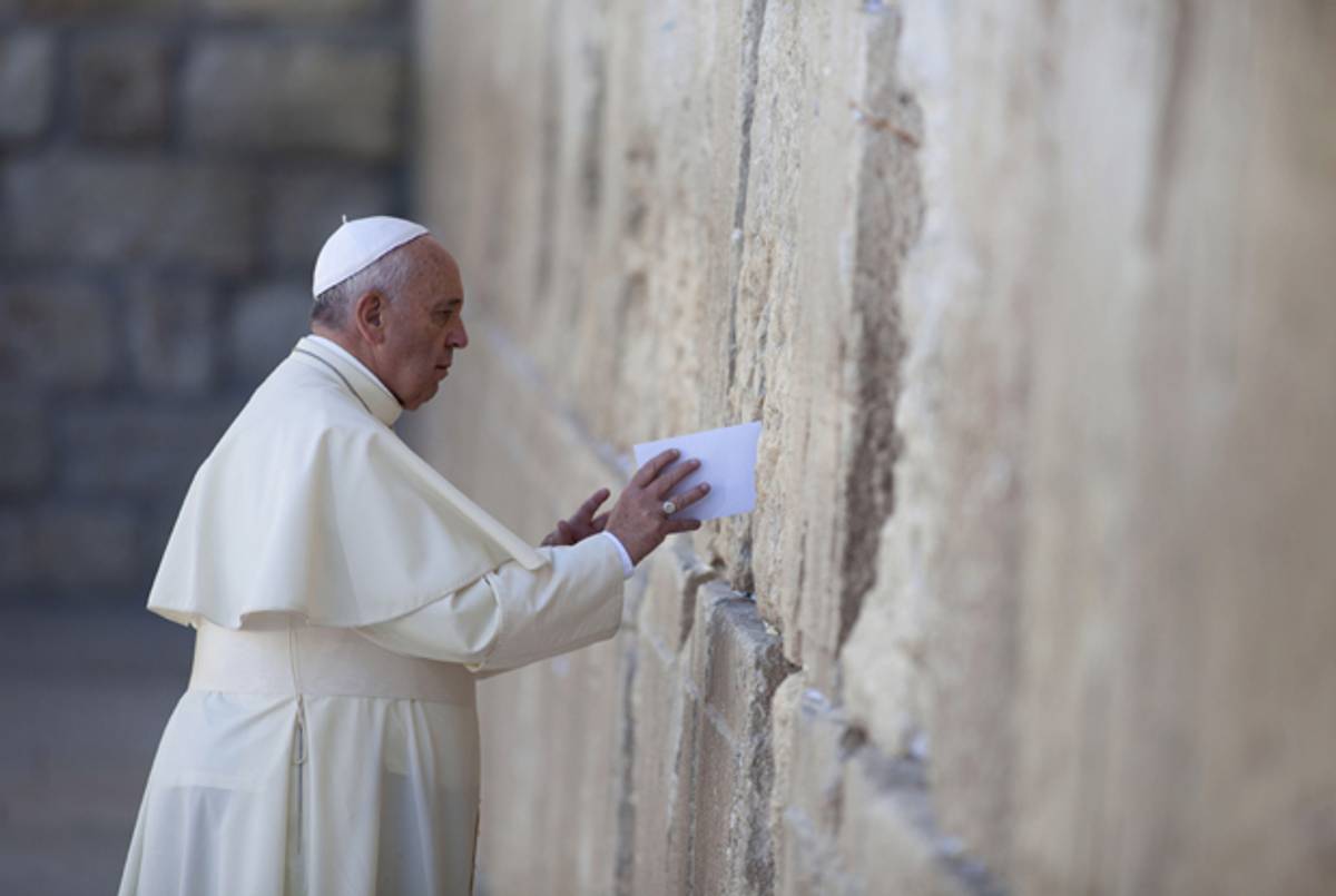 Pope Francis places a prayer into the Western Wall on May 26, 2014 in Jerusalem, Israel. (Lior Mizrahi/Getty Images)