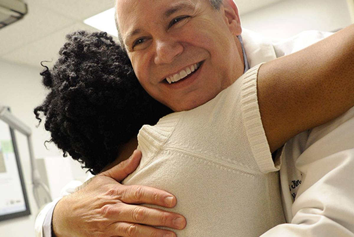 Dr. Michael Saag with one of his patients, 2013.(Courtesy of UAB Media Relations)