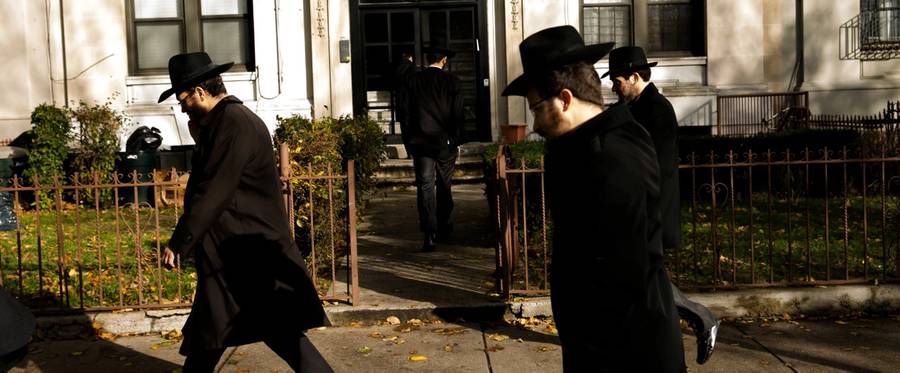 People leave after a group photo, part of the annual International Conference of Chabad-Lubavitch Emissaries, in front of Chabad Lubavitch World Headquarters on Nov. 19, 2017, in the Crown Heights neighborhood of Brooklyn, New York City. 