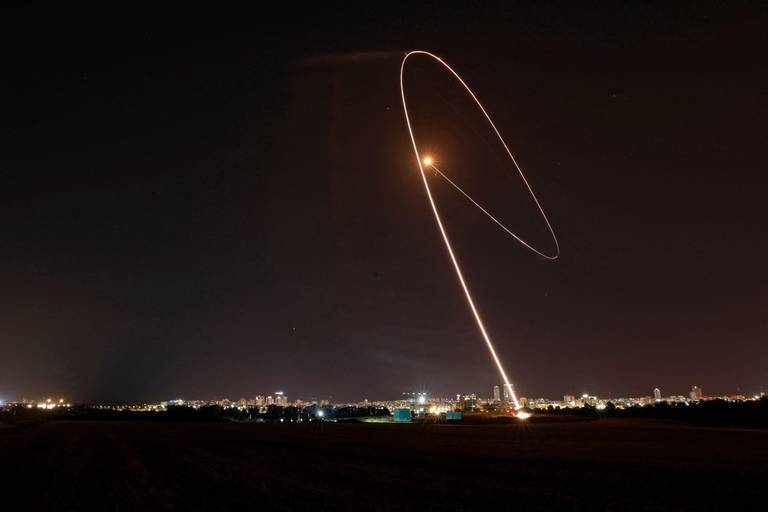 Israel’s Iron Dome aerial defense system intercepts a rocket launched from the Gaza Strip, controlled by the Palestinian Hamas movement, above the southern Israeli city of Ashdod, on May 11, 2021