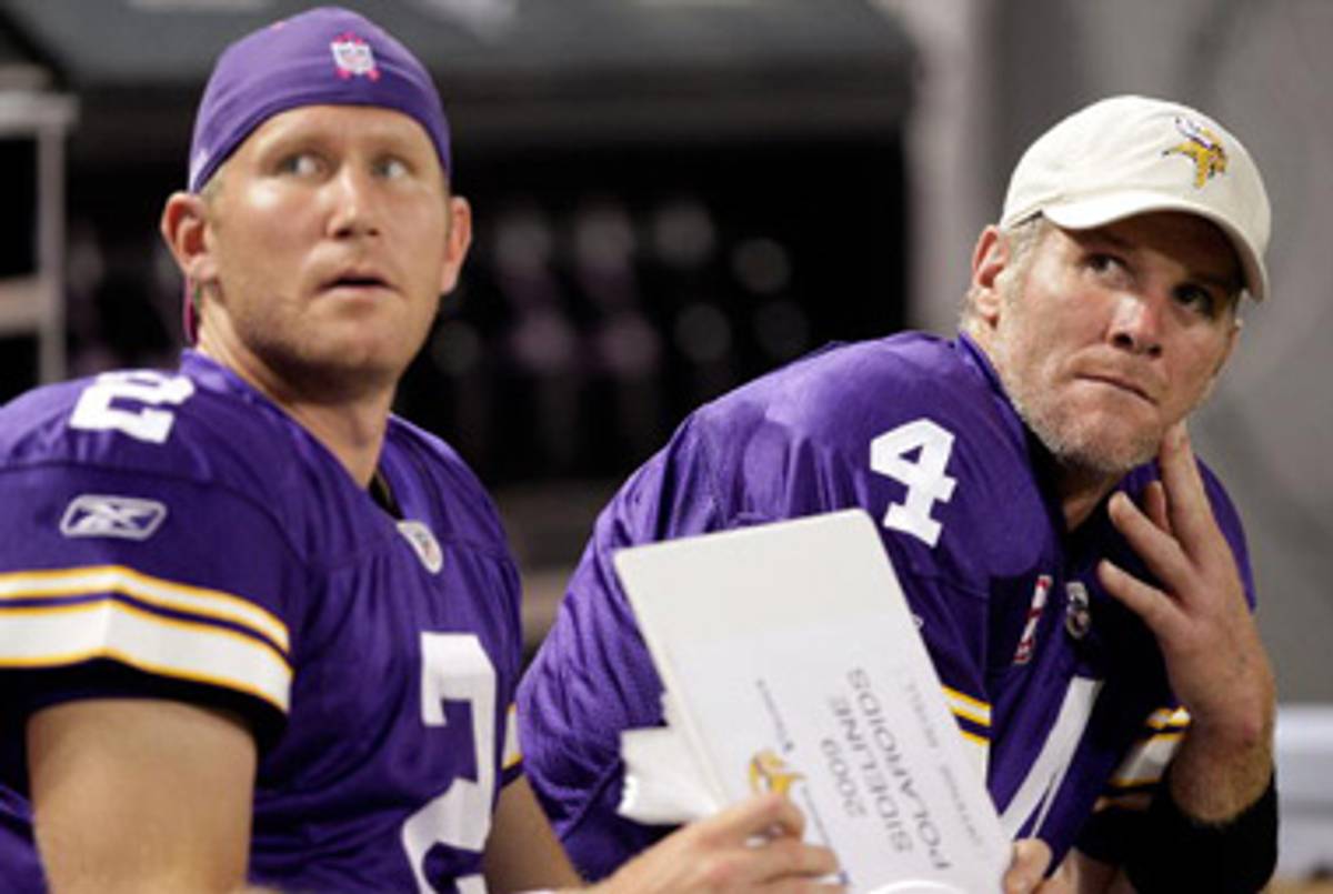 Quarterbacks Brett Favre #4 and Sage Rosenfels #2 of the Minnesota Vikings watch the scoreboard from the bench during the Monday Night Football game against the Green Bay Packers on October 5, 2009 at Hubert H. Humphrey Metrodome in Minneapolis, Minnesota.(Jamie Squire/Getty Images)