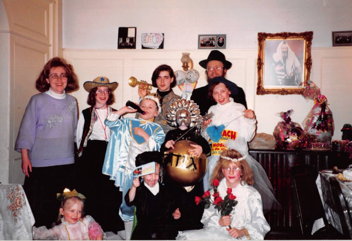 The author (front row, in the middle) and her family on Purim