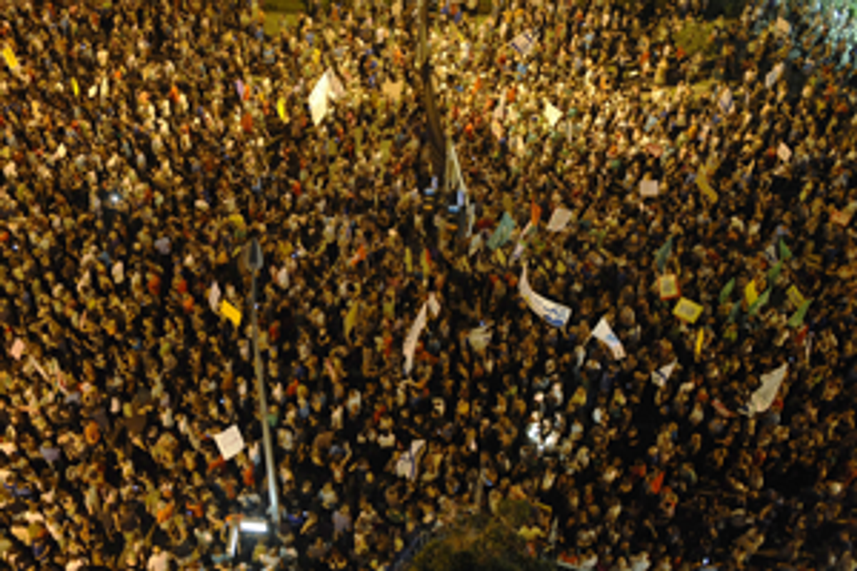 Some 200,000 Israelis march in the center of Tel Aviv on August 6, 2011, demanding social justice and to pressure the government into reforms to ease living costs. (David Buimovitch/AFP/Getty Images)