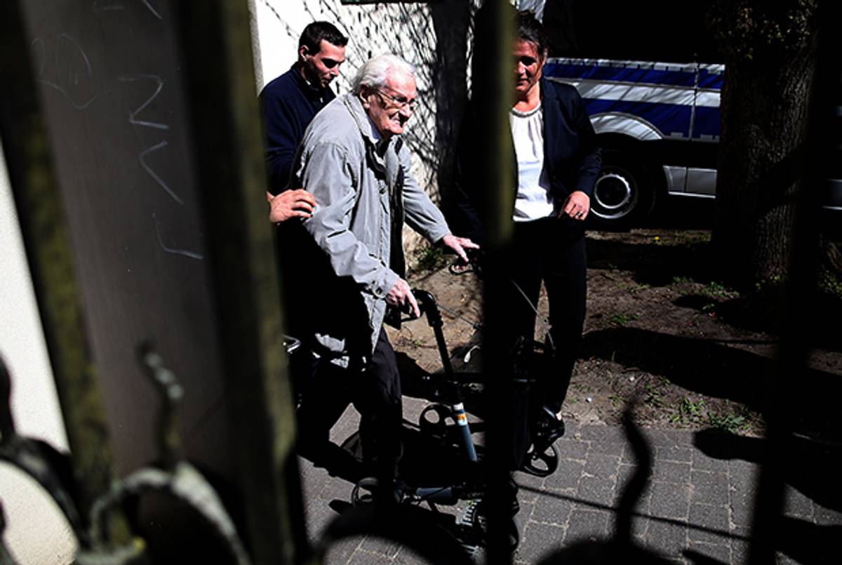 Former Nazi death camp officer Oskar Groening leaves the court after the first day of his trial on April 21, 2015 in Lueneburg, Germany.(Ronny Hartmann/AFP/Getty Images)