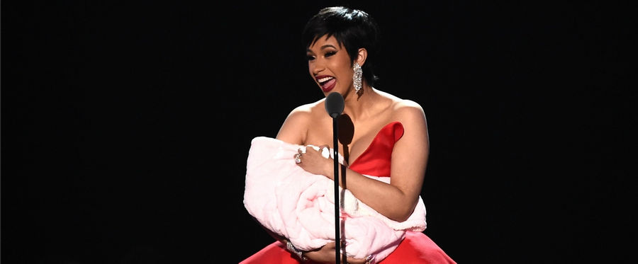 Cardi B speaks onstage during the 2018 MTV Video Music Awards at Radio City Music Hall on Aug. 20, 2018, in New York City.