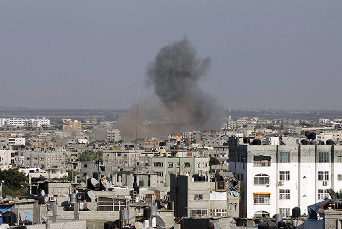 Smoke billow following an Israeli air strike in Rafah, in the southern of Gaza Strip, on August 19, 2014. Israel carried out at least four air strikes across Gaza and ordered its negotiating team back from truce talks in Cairo after three rockets hit the country's south. (SAID KHATIB/AFP/Getty Images)