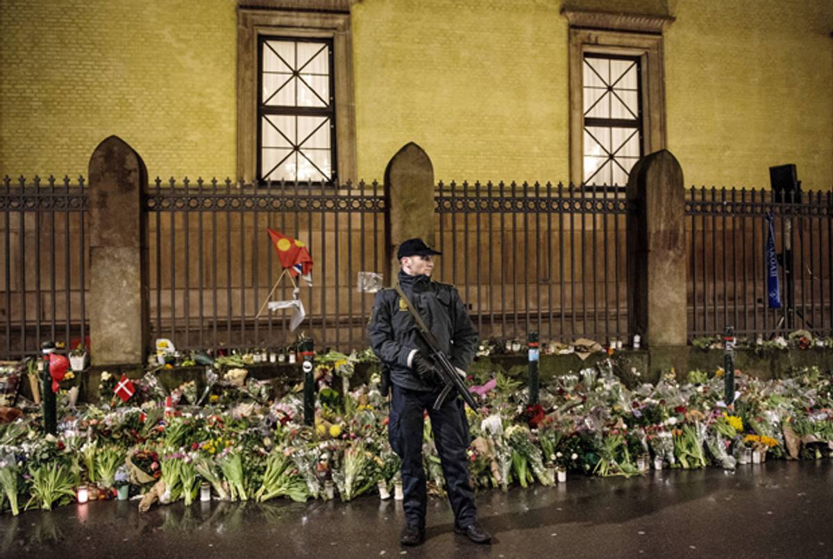 An armed police officer outside the Jewish synagogue during a memorial service in Copenhagen on Febuary 24, 2015, for Dan Uzan and Finn Noergaard killed during the twin terrorist attacks last week in Copenhagen. (BAX LINDHARDT/AFP/Getty Images)