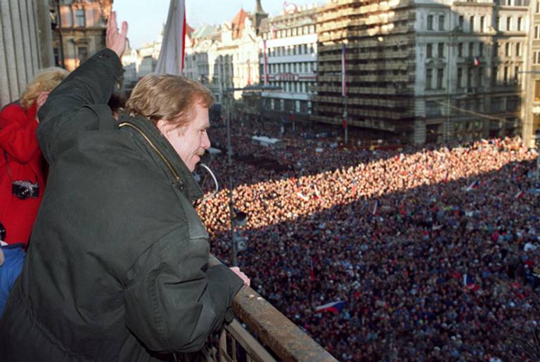Havel waves to the crowd in Prague in December 1989.(Lubomir Kotek/AFP/Getty Images)
