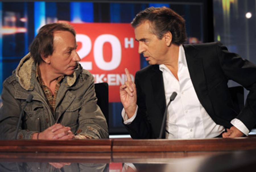 Michel Houellebecq and Bernard-Henri Levy promoting their book of letters on French television after its publication there, two years ago.(Olivier Laban-Mattei/AFP/Getty Images)
