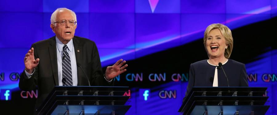 Democratic presidential candidates U.S. Sen. Bernie Sanders (I-VT) (L) and Hillary Clinton take part in a presidential debate sponsored by CNN and Facebook at Wynn Casino in Las Vegas, Nevada, October 13, 2015. 