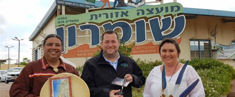 Joseph and Laralyn RiverWind with the head of the Samaria Regional Council, Yossi Dagan