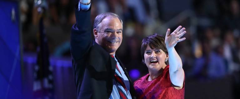 US Vice President nominee Tim Kaine along with his wife Anne Holton, wave to the crowd after delivering remarks on the third day of the Democratic National Convention at the Wells Fargo Center, July 27, 2016 in Philadelphia, Pennsylvania. 