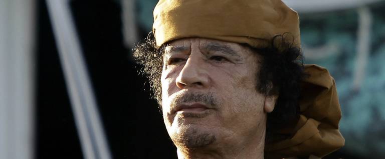 Moamer Kadhafi outside his tent in the garden of his Bab al-Aziziya residence after his meeting with African leaders in Tripoli, Libya, April 10, 2011. 