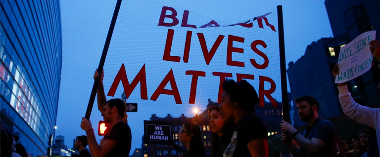 People shout slogans during a protest in support of the Black lives matter movement in New York on July 09, 2016. 