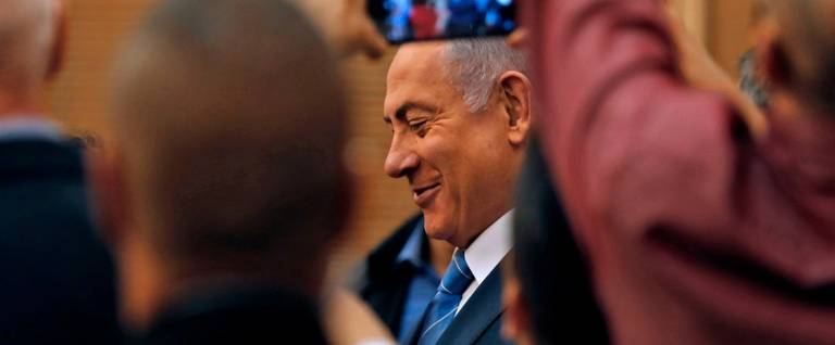 Israeli Prime Minister Benjamin Netanyahu smiles as he delivers a statement following a meeting of the Likud Party in Jerusalem on Sept. 23, 2019 