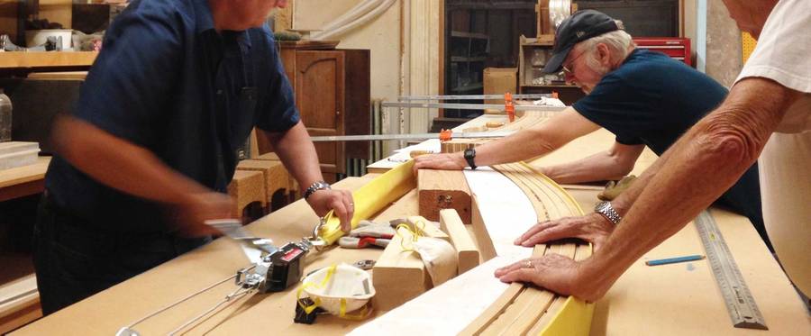 Ark Builders bending the wooden slats for the bench.